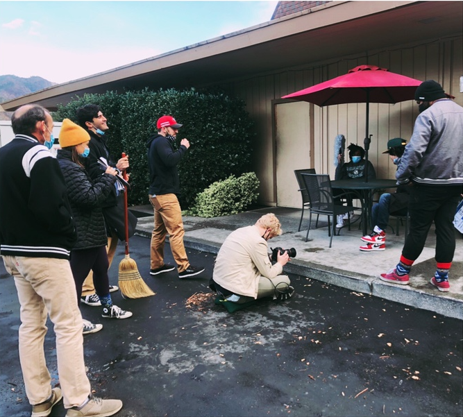 Cast and crew filming a scene