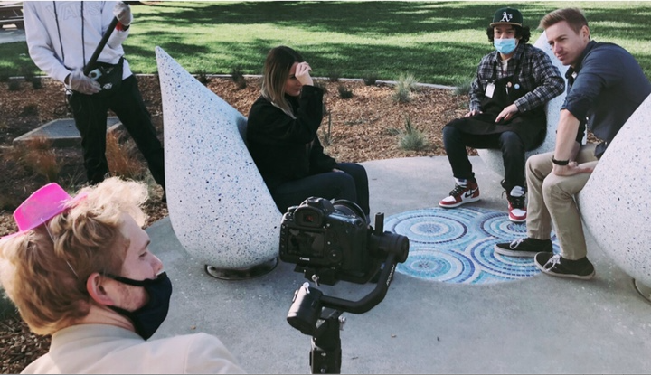 Cast and crew filming a scene